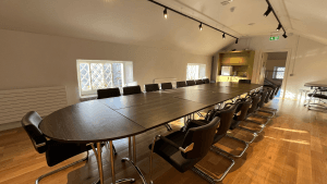 Large Image of the Conference room at Vandeleur Walled Garden & Visitor Centre. Image of a light-filled, spacious board room with a conference table and chairs.