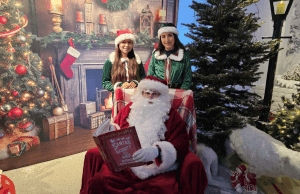 Santa and his elves in front of a festive background in Vandeleur Walled Garden and Visitor Centre in Kilrush, County Clare