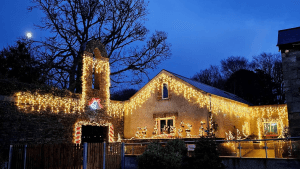 Image of Vandeleur Walled Garden and Visitor Centre festooned with Christmas lights for the Christmas Glow in the Garden Experience in 2025.